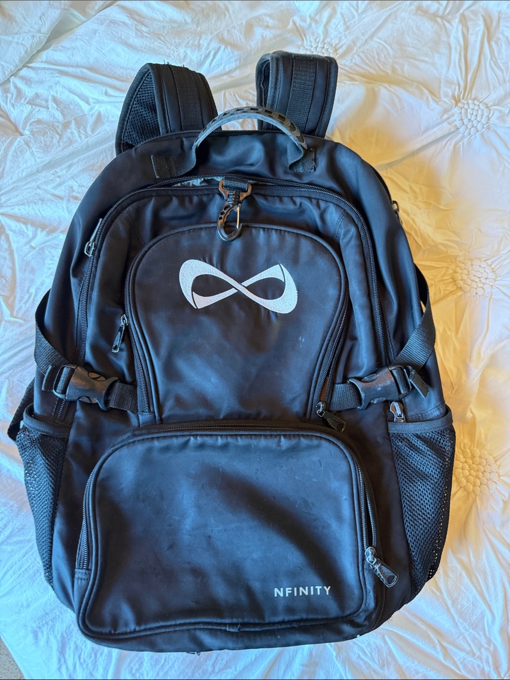 NFINITY Backpack w stitched White Logo. Many compartments. Detachable bag too.